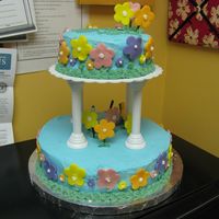 Wilton Iii Final Cake First tiered cake. Blue butter cream with fondant flowers