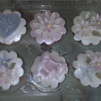 Bridal Cupcakes these went with the wedding dress bridal cake! gumpaste flowers painted with pearl dust