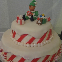 Candy Cane/elf Christmas This was made for a "Christmas in October" fundraiser for a little girl in my community with cancer. Top layer: white cake with...