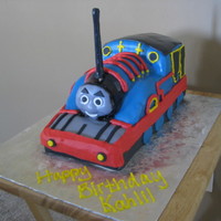 Thomas The Tank Engine Thomas, covered in fondant accents. My kids told me that he looks kind of scary, lol! I hope the birthday boy doesn't get scared of...