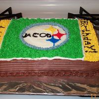 Football Field Cake I made a single layer sheet cake and used my nephew's football team the Steelers as the decoration in the center, I used the end zones...