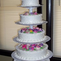 1St Wedding Cake Wasc & chocolate layers with buttercream icing.Flowers are buttercream &are air brushed- tye-died purple,pink,yellow, green&...
