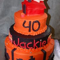 Orange & Black Motorcycle And Snoopy b-day cake for good friend. She is a huge snoopy fan and guess I should mention that we are all bikers too!! Wanted to do a lot more bike...