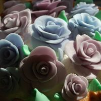 Roses my first try at roses, not too bad, a bit time consuming, but will surely do it again soon -- fondant with some gumpaste added