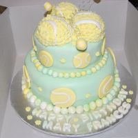 Tennis Balls devils food with strawberry cream cheese buttercream, covered in Colette Peters' fondant, decorated with fondant :)