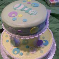 Circles Baby Shower Kahlua cake with dark chocolate ganache filling. Buttercream with fondant accents.
