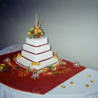 Square Wedding Cake I made this for my daughters Oct. wedding. This was my first attempt at a wedding cake of this size. white, almond flavored cake-strawberry...