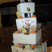 Fall Wedding Cake white chocolate leaves, marzipan pumpkins and carmel acorns.