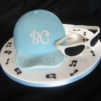 Cap & Sunglasses The cap was a sponge baked in a bowl and I made the glasses from modelling paste.