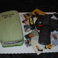 D-40 Camera Cake Everything is edible, except the photos. Camera is cake with buttercream icing and fondant details!