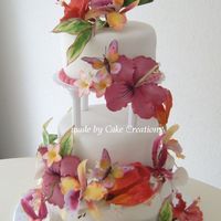 Tropical Wedding Cake Bride wanted a tropical wedding cake with a Bird of Paradise on top. Lemon cake, filled with cherry cream, raspberries and pinapple...