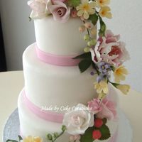 Strawberries And Summer! Almond cake with cherry filling and iced in chocolate ganache and fondant. All flowers are gumpaste. Bride wanted a summer wedding cake...