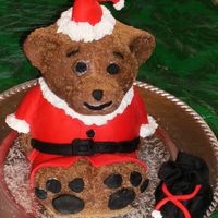 Teddy Clause this is a build a bear pan with fondant for clothes and instead of toys in his bag there is mimi marshmellows