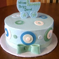 Welcome Bryce WASC cake with chocolate chip cookie dough filling. bow, carriage and trim are gumpaste, circles are MMF. TFL!!