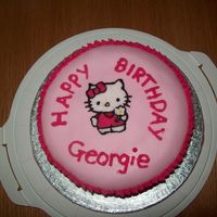Hello Kitty 16th birthday cake. Hello Kitty FBCT, baby pink roll out icing and hot pink piped icing used for decoration. First cake i've ever made...
