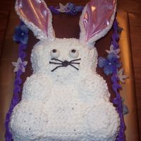 Bunny Cake a teaddy bear mold used for a bunny cake. bunny ear headband used for ears.