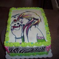 100_3505.jpg 14th birtday cake. edible images and whip icing. silver dragees & multi colored jaw breaker minis. the girl was hand painted with food...