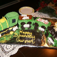 Birthday Choo Choo White cake, done with buttercream frosting...using the betty crocker train pan.. oreos for wheels.