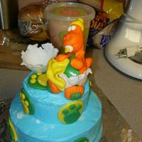 Ready To Hatch white cake with buttercream frosting, dino ,eggshell and all accents done with mmftfl