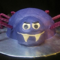 Spider Cream cheese frosting, fondant face, grape licorice legs.