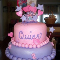 Abby Cadabby Fondant covered two tier with fondant/gumpaste decorations and store bought candles