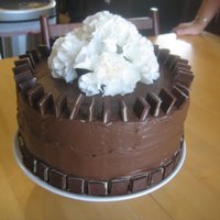 10Th Anniversary Chololate Mint Cake 3-tier chocolate mint cake with Andes candies, white carnations. Filling was creme-de-menth green icing. chocolate buttercream (from a pre-...