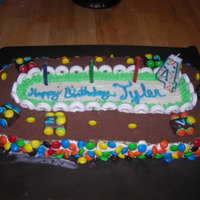 Racecar Cake Chocolate single layer cake. I used a rectangular pan and a round pan. I cut the round in half and added the halves to the short ends of...