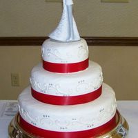 Red And Silver Wedding Cake Buttercram with pearl and silver dust accents