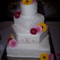 Maycakes2008_056.jpg Buttercram frosting. Fondant intials.