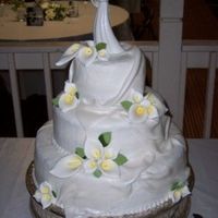 Callalily Cake 3 tier , Buttercream icing with fondat drapes with pearl dust and gumpaste callalilys