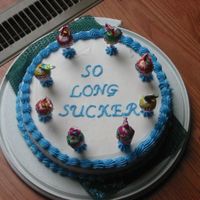 So Long Sucker 10 inch cake done on my last day at work... buttercream frosting and different flavor lollipops.