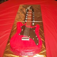Electric Guitar My very first carved cake. Chocolate cake with buttercream frosting and fondant accents. This was made for my son's 12th birthday. He...