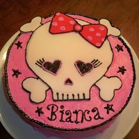 Girly Skull This cake was made for my niece's 18th b-day. I thought it was cute and fit her personality and style pretty well. Darn good chocolate...
