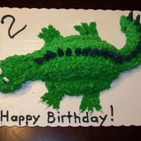 Dinosaur Cake This was my first ever cake that didn't just have some icing slapped on it. I made it for my son's 2nd birthday. Body, tail, and...