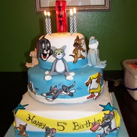 Tom And Jerry Cake Tom & Jerry cake for my son's 5th birthday. Covered in fondant, decorations were cutout fondant hand painted.