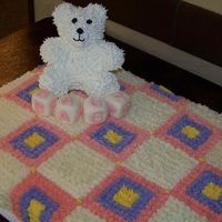 Bear Baby Shower Buttercream baby blanket, rice krispy bear covered in royal icing, and fondant blocks. My hand is killing me!