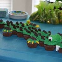 Alligator Cupcakes Cake Alligator cupcakes, very cute and fun to make. The spikes are 100 Calorie Oreo Crackers, the teeth and eyes are marshmallows, the "...