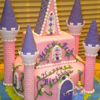 Castle Cake Castle cake was made with 9in circle and 6in square. Covered and decorated in MMF. Tower and steeple was from Wilton Castle Kit.