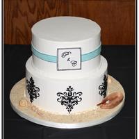 Sandy Damask Engagement cake. They love to fish so they wanted something 'beachy' but also based on the napkin they provided. IMBC, black BC...