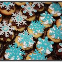 Sweet Snow Vanilla and chocolate mini cupcakes with chocolate/vanilla BC. Adorned with hand piped chocolate snowflakes. Love how they turned out, but...