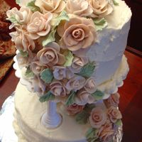 003.jpg Wilton III final class project. BC icing with fondant roses.