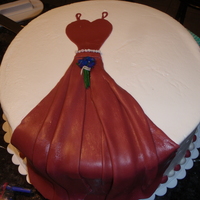 Wedding Reception Wedding cake I made for my cousin, she did not go traditional. Little people are made of fondant and the box cake is a home made carot cake...