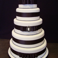 Black And White Wedding The bride picked this cake from Wedding Cakes magazine. I think it was done by Lucky Sixpence. I hope I did it a little bit of justice.