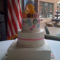 Baby Shower Cake Buttercream covered 3 tier baby shower cake with fondant, gumpaste, and molded sugar decorations. The client wanted the baby's...