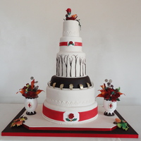 Fall Wedding Cake Fall wedding cake I finished today. Gumpaste flowers and floral plaques, fondant cake covering.