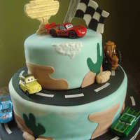 Cars Cake! This was covered in marbled fondant to mimic the sky, and the "mountains" as well. Thanks to some CC members for the inspiration...