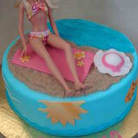 Barbie Beach Cake Butter cream covered with fondant and gum paste details. Real Barbie on top. TFL!