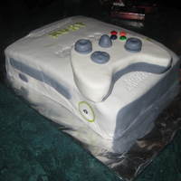 Xbox An xbox cake for my son coz he lives with it.