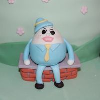 Closeup Of Humpty Dumpty From Mother Goose Cake 50/50 fondant and gumpaste. I'm disappointed that I did such a poor job on his eyes! Either eye is okay, but together they are too...