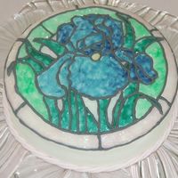 Stained Glass Iris A simple little cake for my mother for Mother's Day. WASC with IMBC, then painted with piping gel and outlined with RI for a stained...